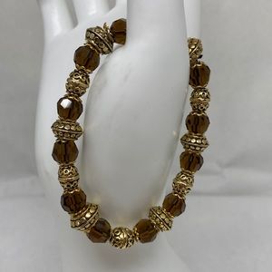 Beautiful glass and gold tone bead stretchy bracelet